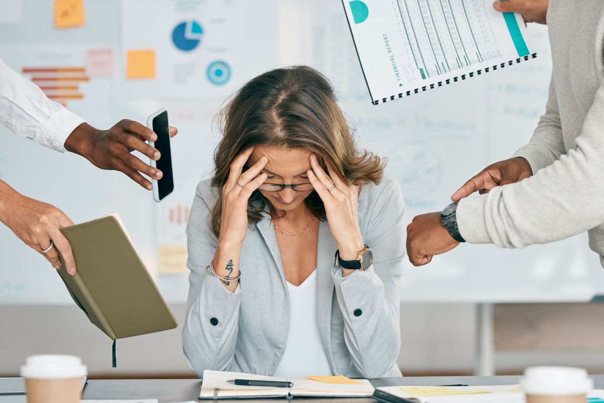 Women with ADHD feeling overwhelmed at work.